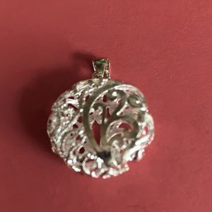 5/$25 Silver puff pendant, costume jewelry.